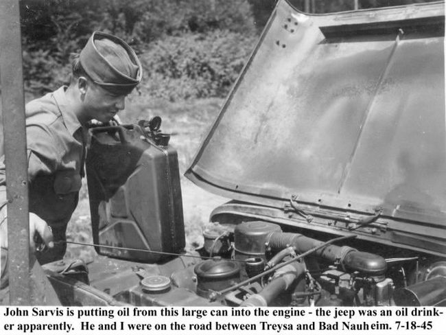 Army 286 Sarvis putting oil into Jeep engine 7-18-45jpg