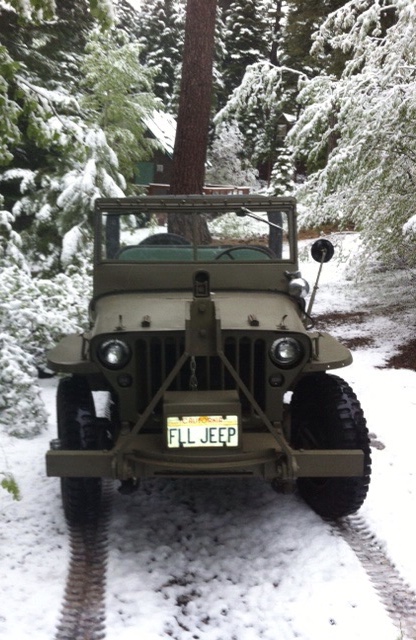 Snow Jeep in the driveway