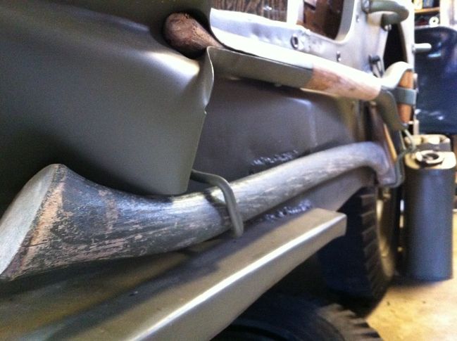 The axe fits the Jeep