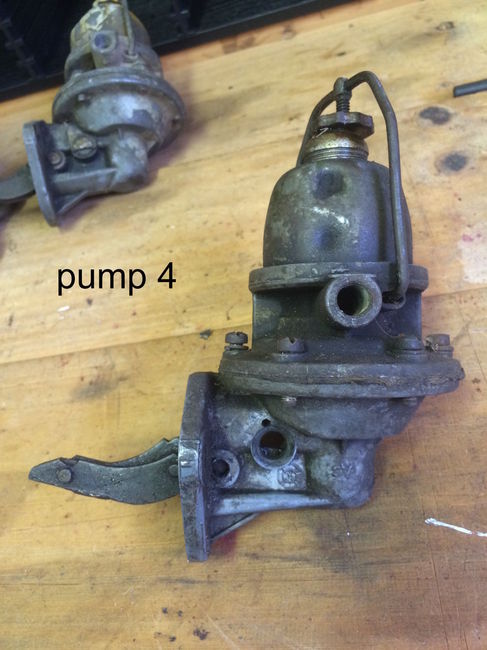 a large group of jeep and Gm wartime dated fuel pumps for sale.