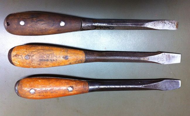 Unmolested ink marked screwdriver surrounded by handle changed examples