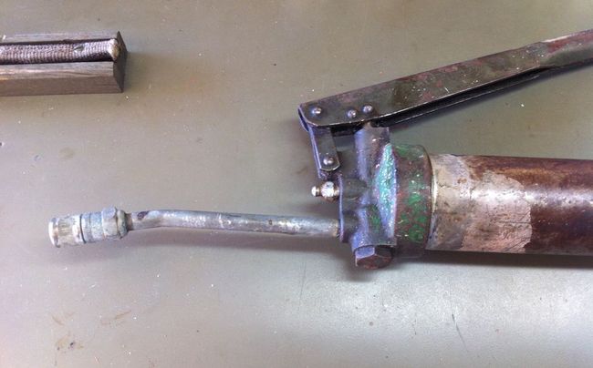 Alemite gun ready to pump grease