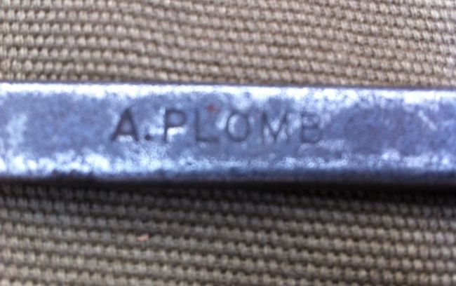 A Plomb marking