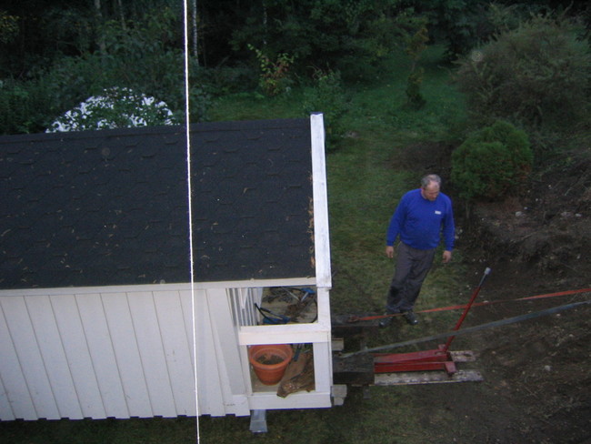 Mowing a cabin up a hill