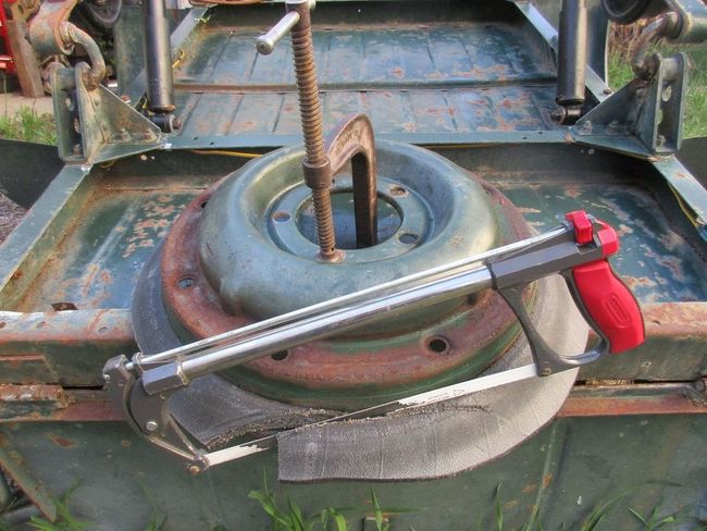 hacksawing off old tire bead