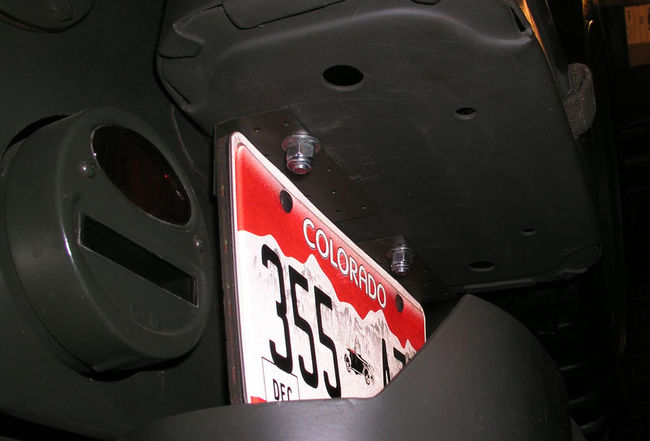 license plate mounted on fuel can bracket